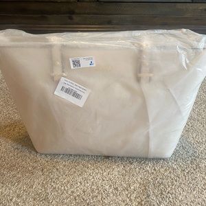 A tote bag, clutch, satchel, and wallet. All for 1